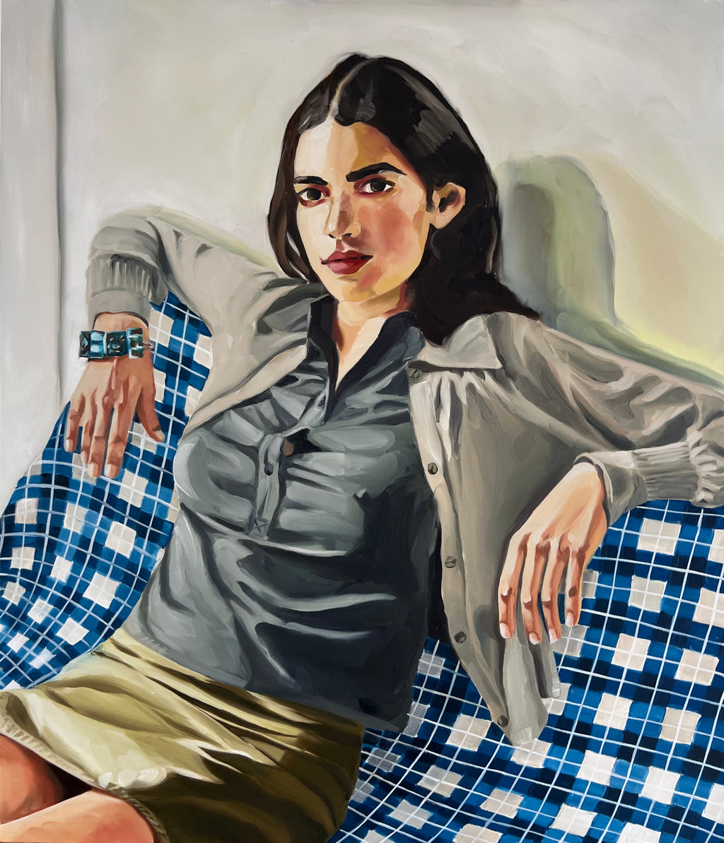 French girl on checkered sofa